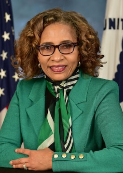 Headshot of Terri Dickerson with American flag