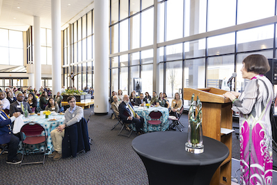 Kimmy Duong addresses the scholarship breakfast