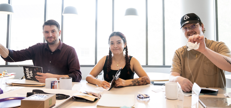 Martin Mitchell, Victoria Mendoza, and Nick Ritter making chapbooks for the students at the JDC. Photo by Evan Cantwell/OUB.