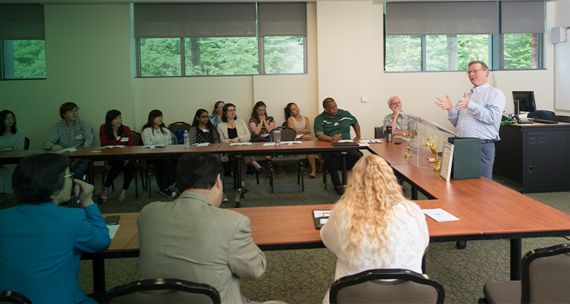 A group of Mason employees attend a lecture