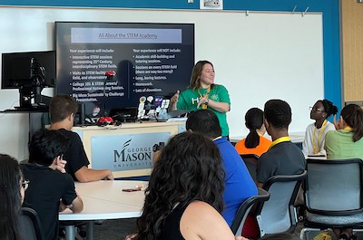 someone presenting to students in a classroom