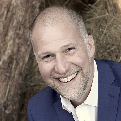 Headshot photo of Michael Shank smiling