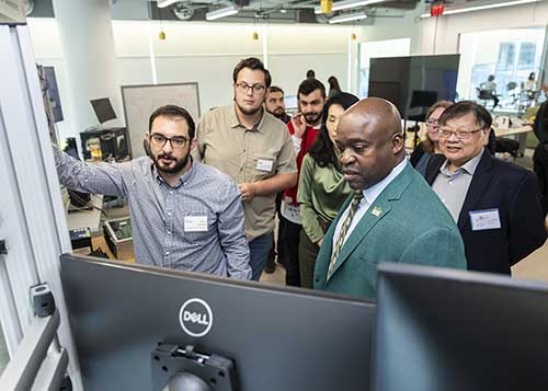 Guests at Fuse Topping Out visit student demonstrations.