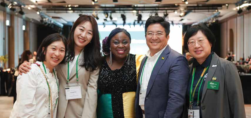 A group of people gather for the camera at a Mason Korea anniversary event.