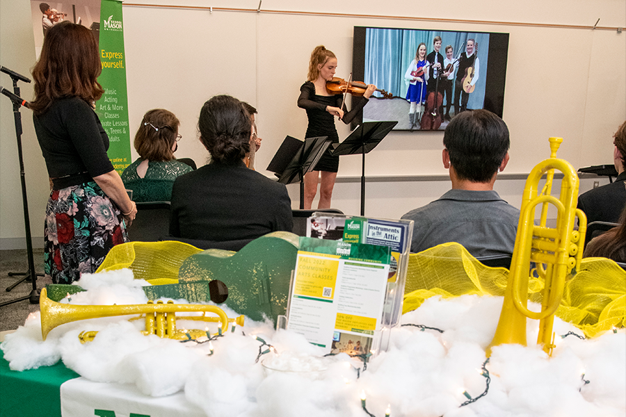 A student from Mason Community Arts Academy performs a song on her violin at ARTS! By George 2022. (Photo by Cable Risdon Photography)