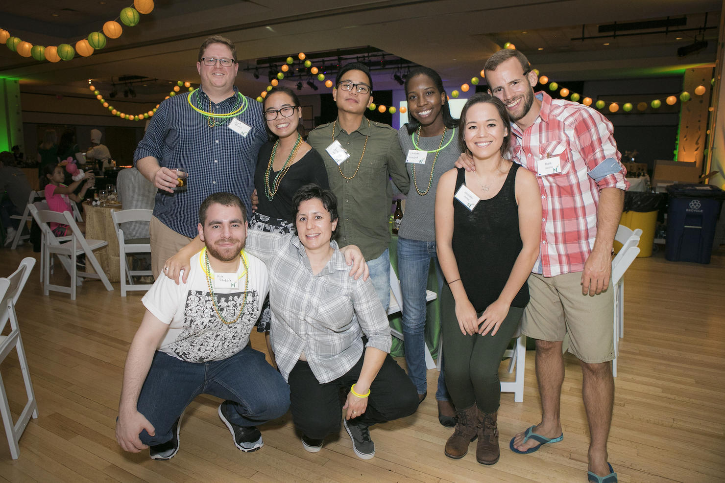 A group of alumni pose for a photo.