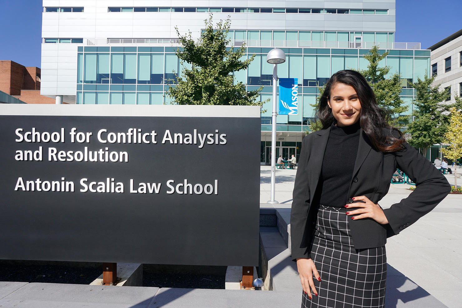Ghazal Khammash poses in front of Arlington Campus.