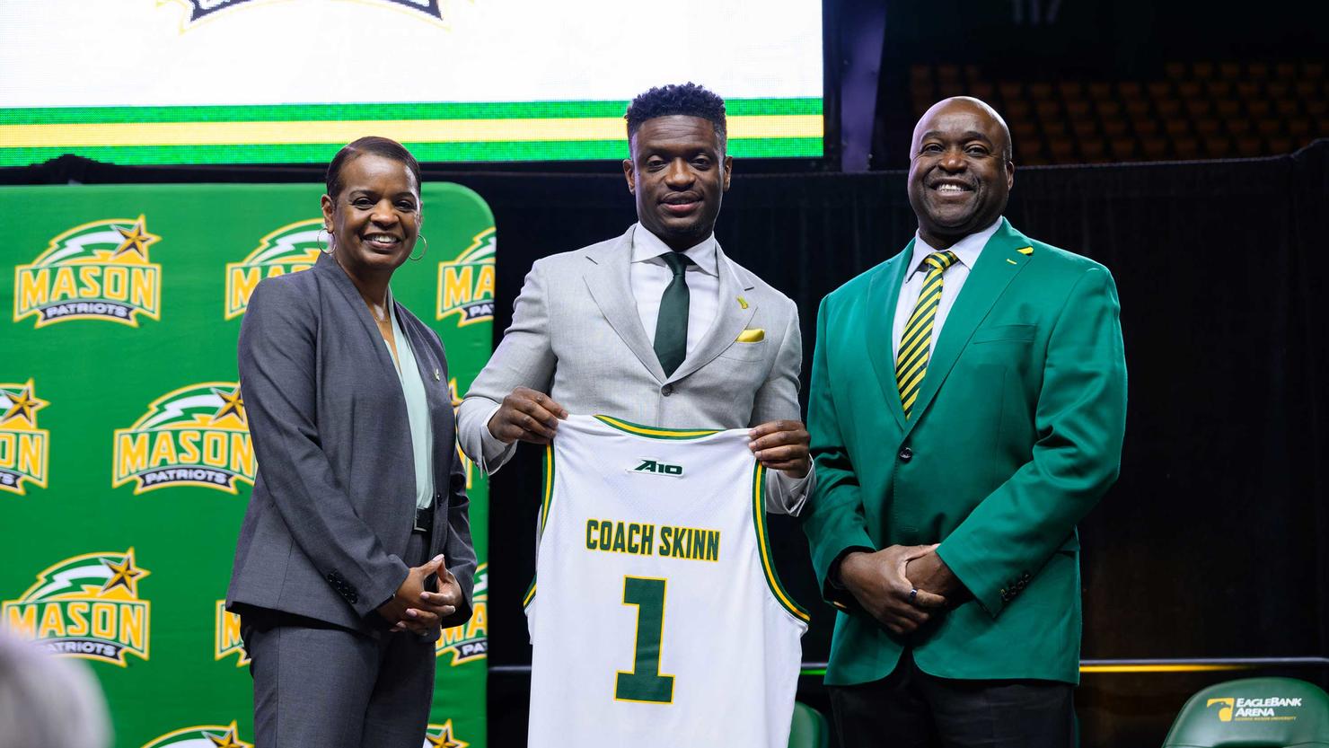 Athletic Director Nena Rogers, and University President Gregory Washington flank new head basketball coach Tony Skinn during the welcome event.