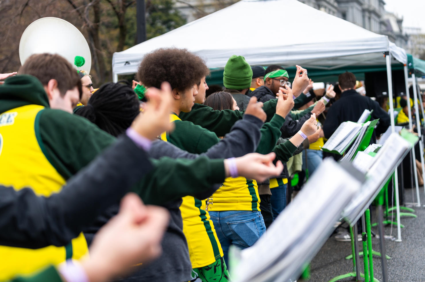 A line of performers snap their fingers as they dance and perform at the White House Easter Egg Roll on April 1, 2024. Photo by Joshua Cruse & Nathaniel Henry / Green Machine Ensembles
