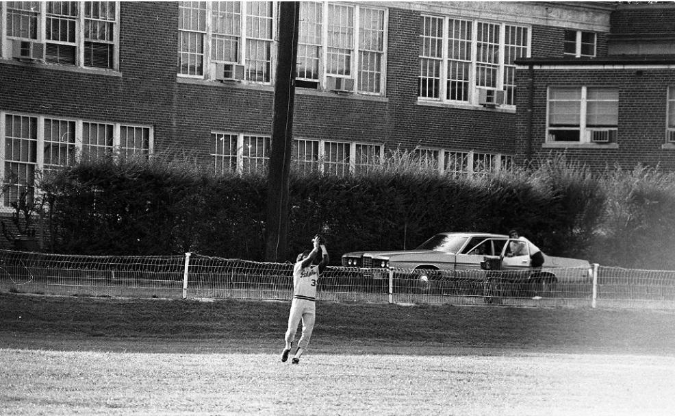 Baseball player in front of former Fairfax High School