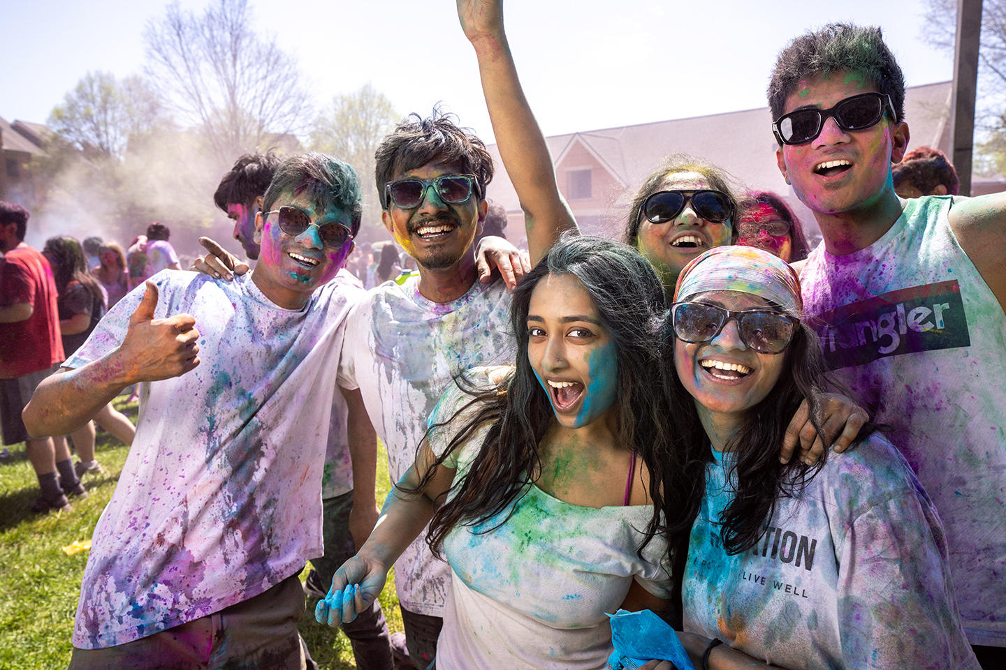 Students are covered in colorful powder at the Holi Moli event