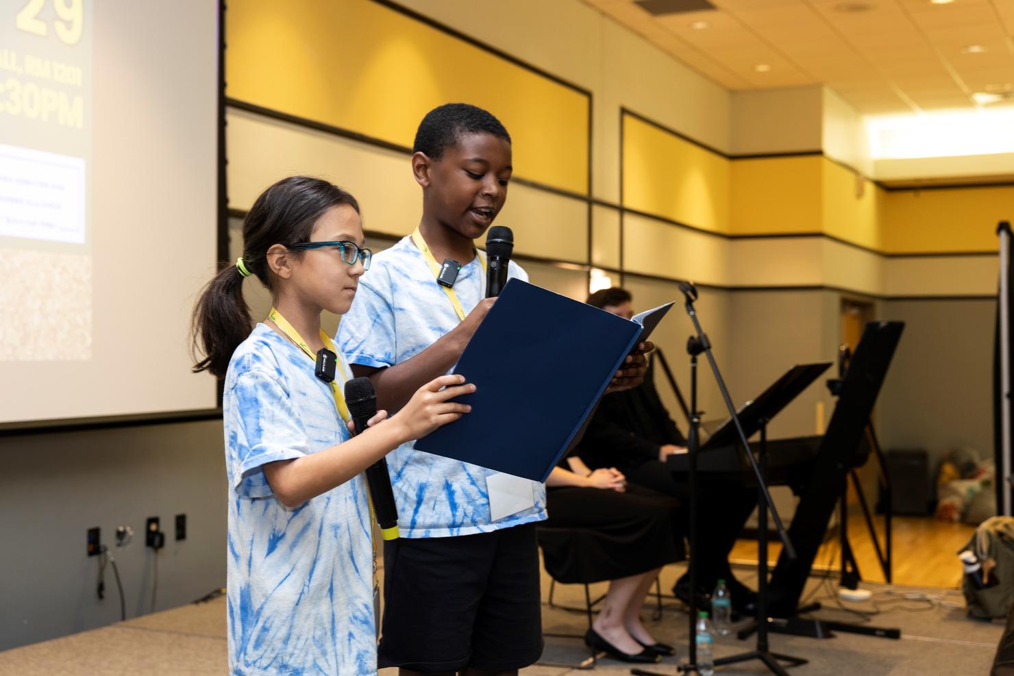 Students from Pattie Elementary School speak on stage