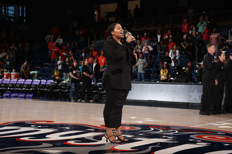 Kristina Ryder performs "The Star Spangled Banner" at a Washington Mystics game