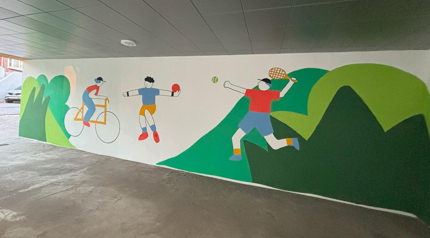 Mural painted by Mason Korea volunteers depicts people biking, throwing shot put, and playing tennis