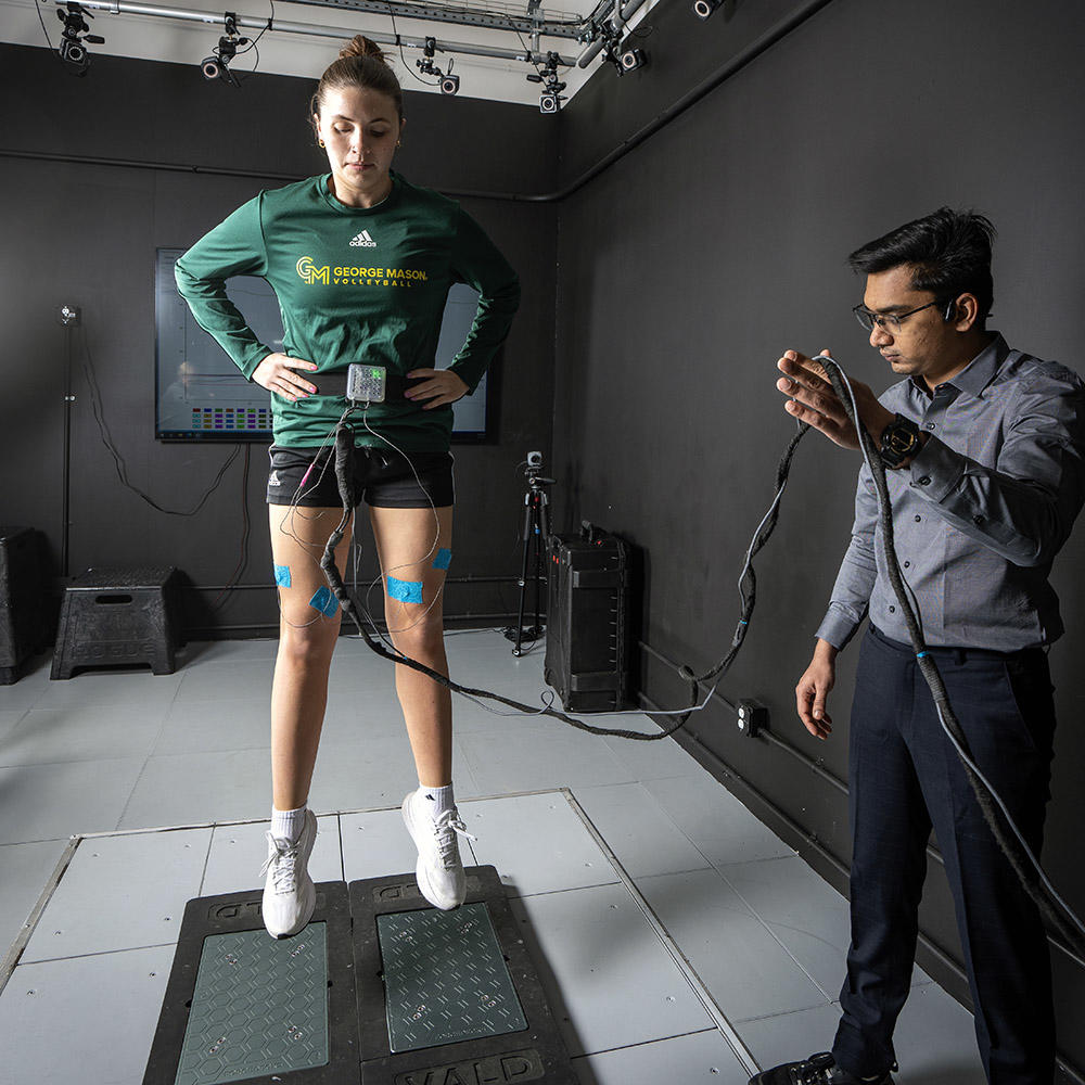 Erica King (left) and researcher testing the Myokinetics device.