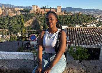 Black female student poses for the camera. 