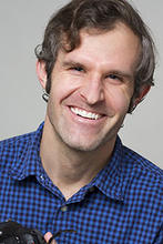 Nicholas Hanson holds a camera