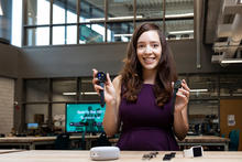 Vivian Motti poses with two smart watches