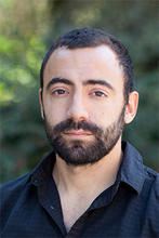 Antonios Anastasopoulos is shown outside wearing a dark button up shirt