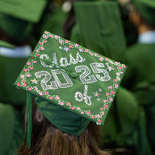 A decorated Bachelors graduation cap with the words "Class of 2025" bejeweled on it.