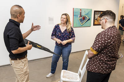 Steven Luu and Michelle A. Smith with her piece "Absence: Grief."
