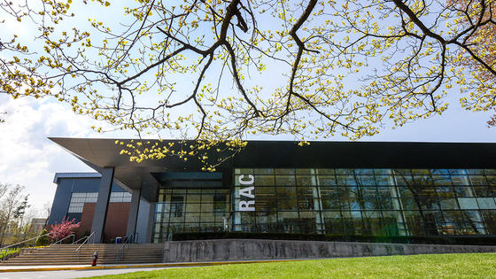 The Recreation Athletic Complex in spring, with trees blossoming in the foreground