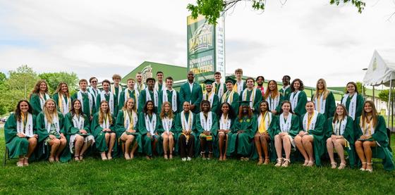 student athletes in cap and gown