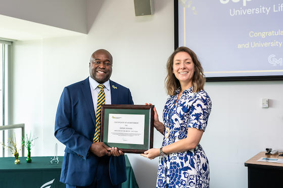George Mason President Gregory Washington and July Employee of the Month Sophie Donora. Photo by Eduardo Macedo/Office of University Branding.