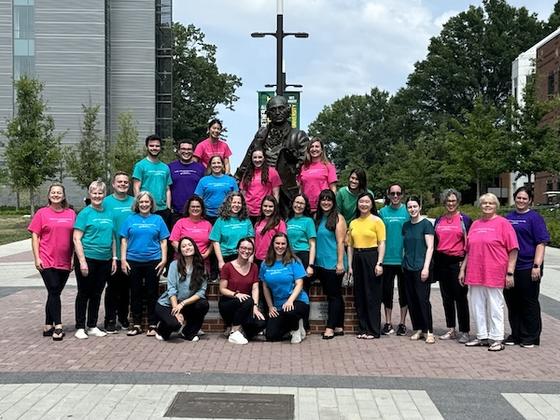 MCAA faculty, staff, and students on the Roger Wilkins Plaza. Photo by Beth Anne Young.