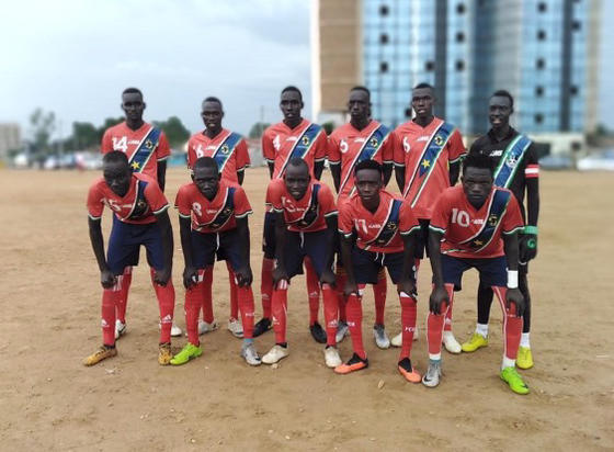 Eliuda with his team in Sudan