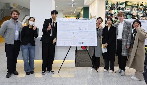 team with their research poster at fall showcase