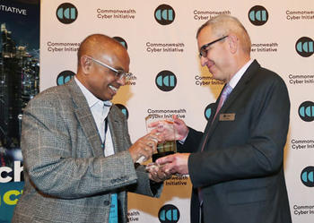 Duminda Wijesekera accepting an award for his work at CCI