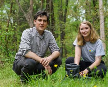 Professor Daniel Hanley and student Anna Siegle pose in the field research location for the study.
