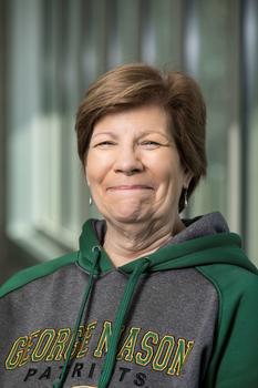 Mason staff member Jeanne Medford wears a Mason sweatshirt