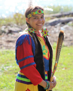 A portrait of George Mason University student Sara Jefferson wearing traditional Chickahominy dress.