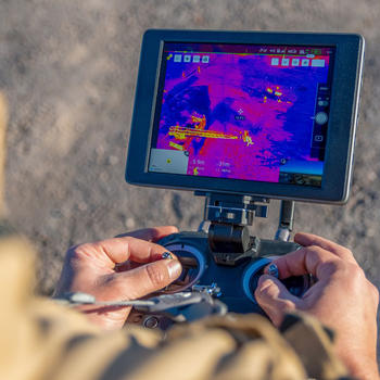 showing someone driving a drone