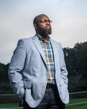 Khaseem Davis outside looking at the horizon.
