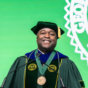 President Gregory Washington preparing to give his speech.