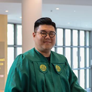 Ji in Horizon Hall pictured in grad gown