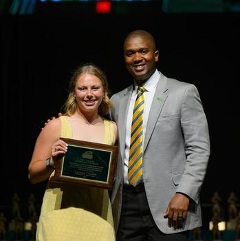 Lauren Distad poses with AD Marvin Lewis