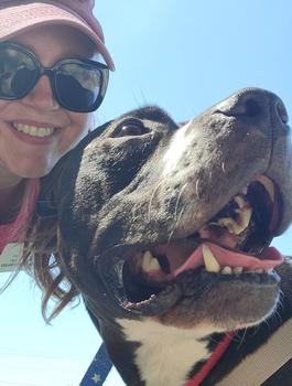 Kim Paul and a dog eligible for adoption