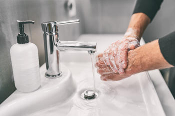 Someone washes their hands