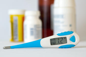 Thermometer reads temperature for a fever