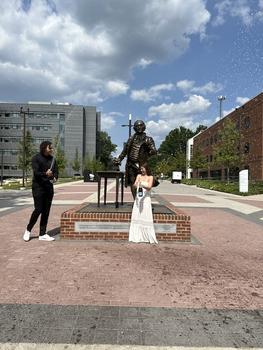 Little and her husband, Joshua Oduro celebrate on Wilkins Plaza. Photo provided.